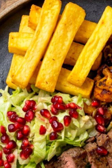 Golden chips with crisp slaw and pomegranate seeds, pub food in Furness, Cumbria