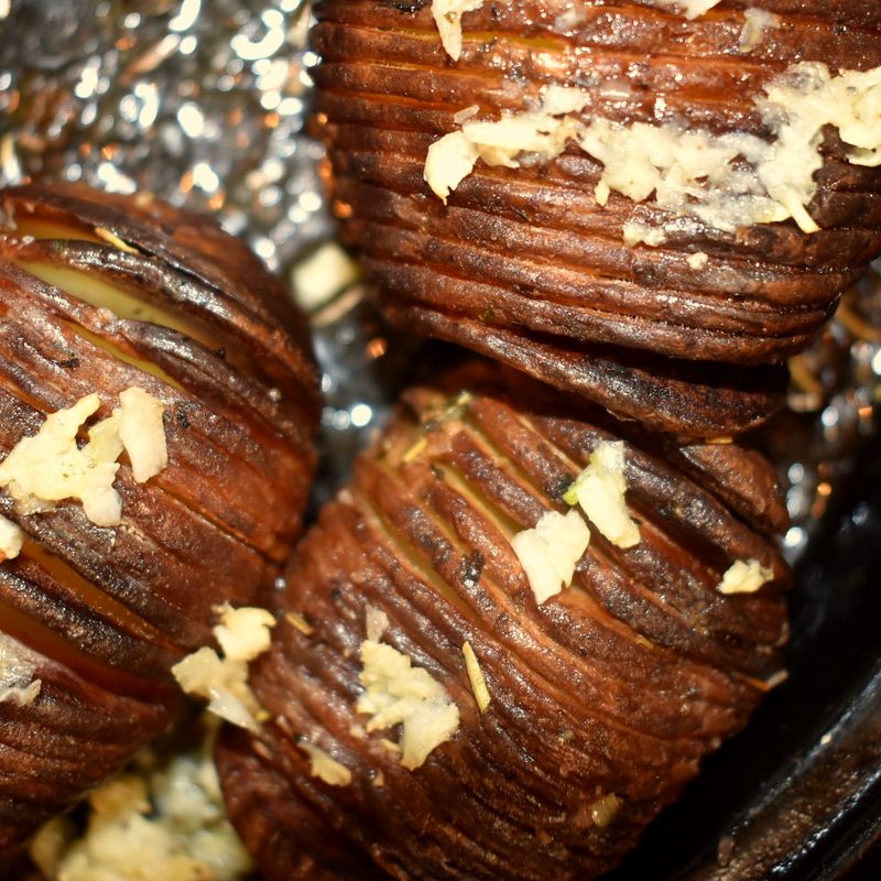 Hasselback roast potatoes with garlic, close up
