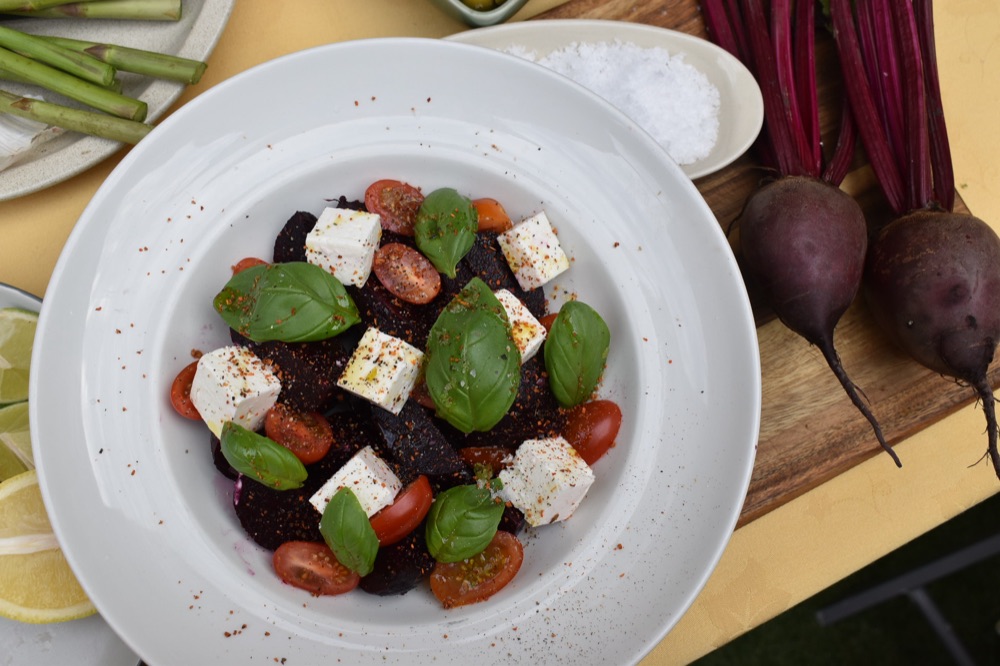 A bright plated dish of roasted beetroot, tomatoes, feta and basil from Light & Salt's test kitchen.