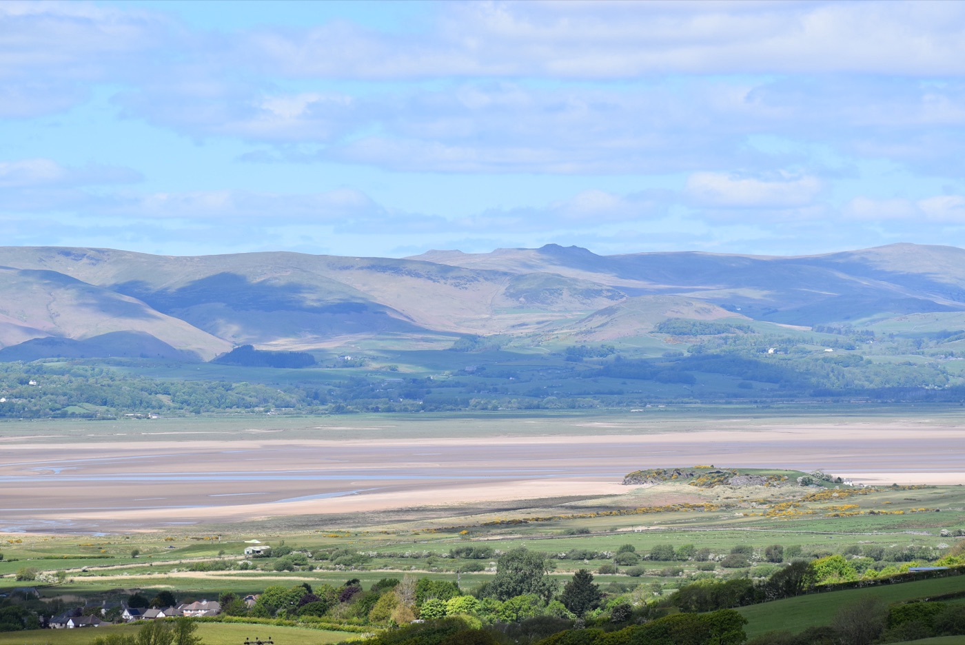 The Furness landscape near Lindal, green farmland looking over the estuary sands to the Cumbrian fells.