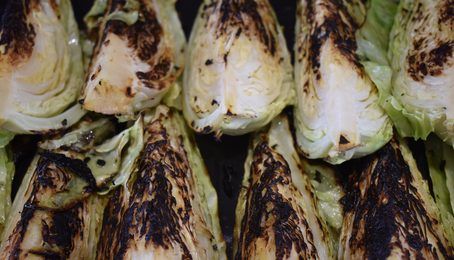 Wedges of hispi cabbage, charred in a hot pan