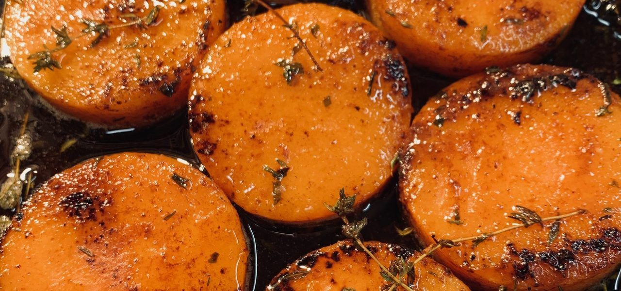 Golden roasted rounds with thyme, caramelised in a dark tray
